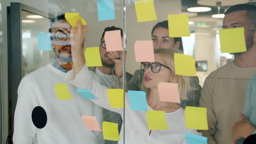 Team working through ideas together on a glass wall